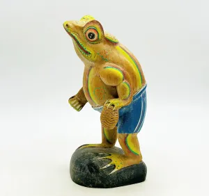 Fun hand painted wooden carved frog figure standing with a basket